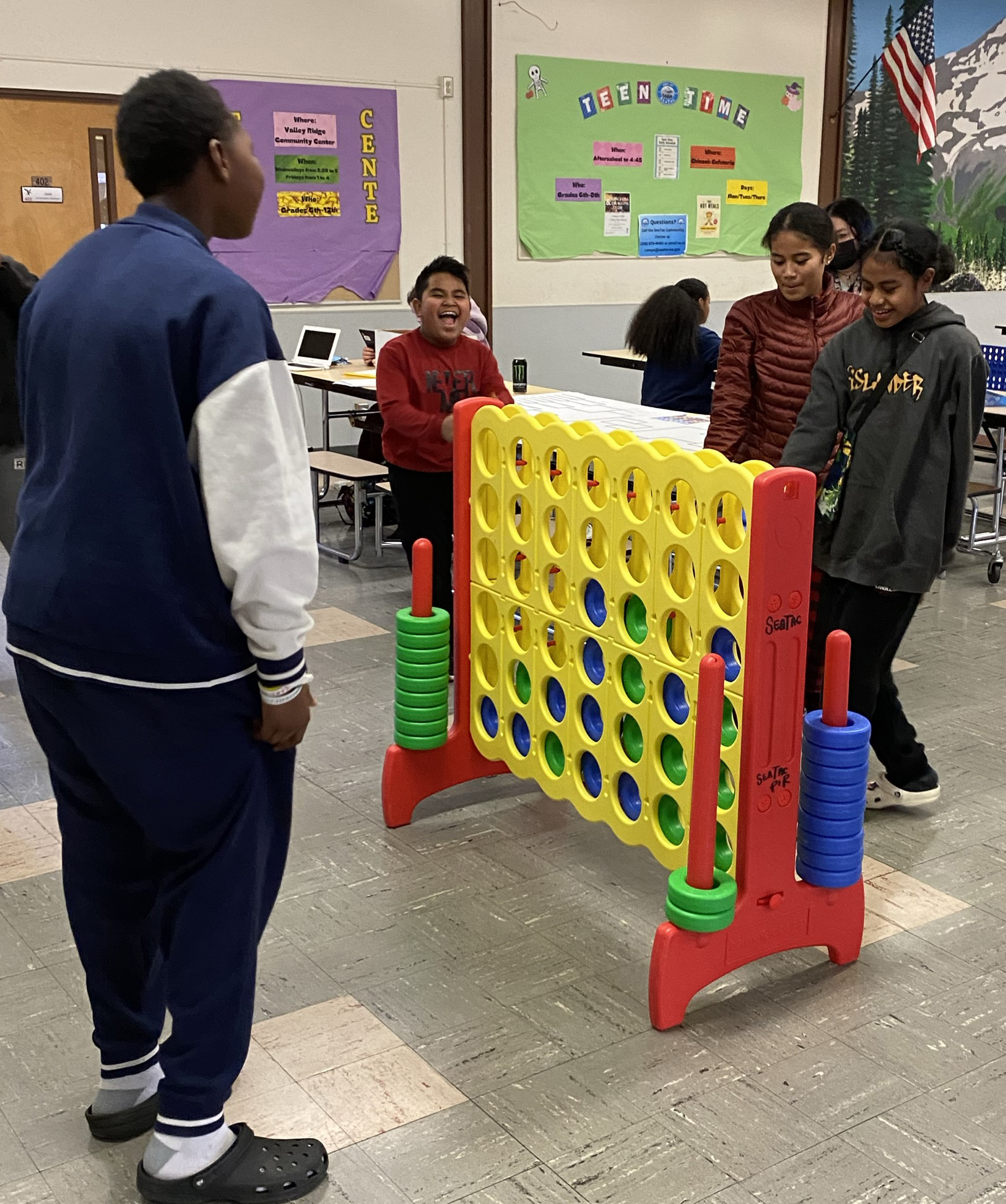 Kids playing a large version of connect four