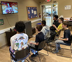 Kids playing a video game together