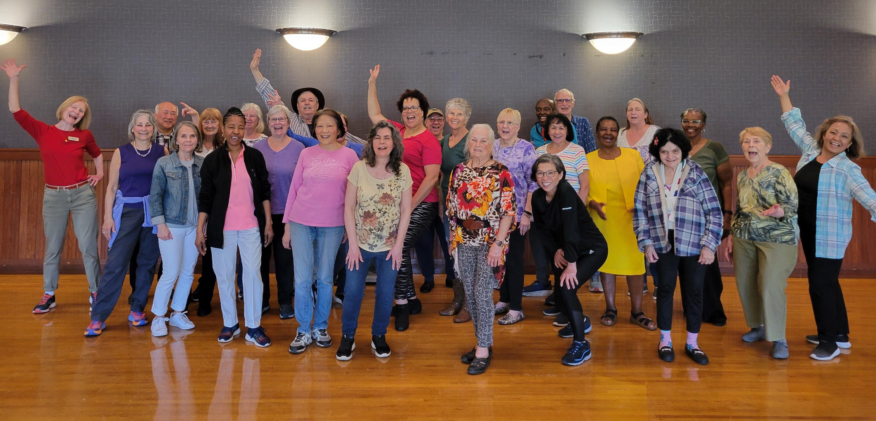 A group of seniors strike a pose during a dance party.